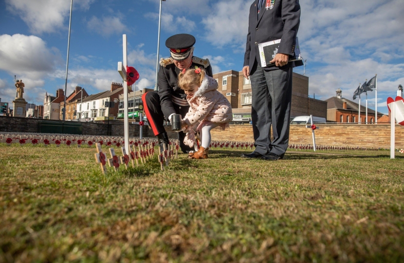 Northamptonshire Lord Lieutenant with child and poppy crosses